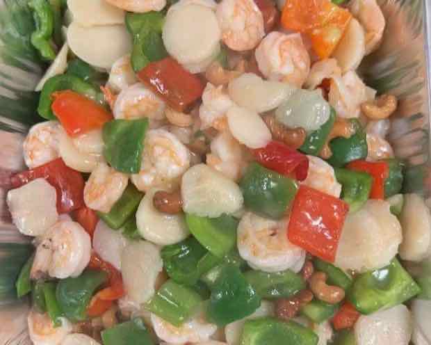 Shrimp and scallop catering tray Full-size catering tray of shrimp and scallops stir-fried with bell peppers and cashews