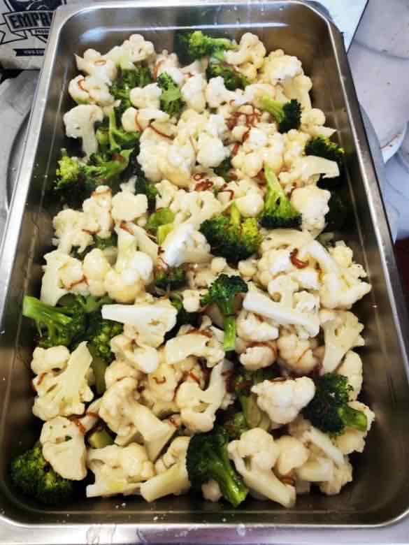 Cauliflower and broccoli Catering tray of stir-fried cauliflower and broccoli florets with garlic